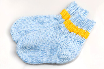 Warm, woolen knitted socks isolated on white background. Warm socks made of wool for winter season. 