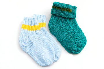 Warm, woolen knitted socks isolated on white background. Warm socks made of wool for winter season. 