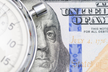 Time is money, value of asset growth over time, financial concept : US USD dollar with a stopwatch, depicting investors deposit or invest for future income or increasing profit in high yield assets.