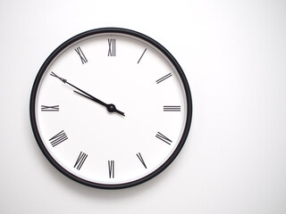 Clock Showing 21.50 or 09.50 with Roman Numerals – Simple Round Clock for Concepts of Time Management and Scheduling.