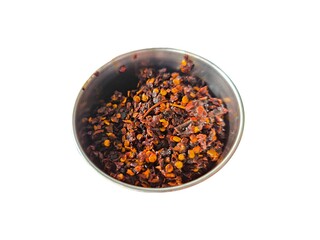 Ground chili pepper isolated on white background. Red hot chili flakes. Food ingredients. Spicy food concept