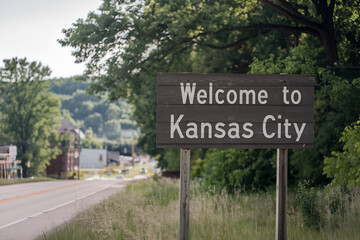 Elegant wooden "Welcome to Kansas City" sign, ideal for US city entrance road signs, travel signage, urban landmarks, and city-themed promotional projects.