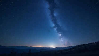 Fototapeta premium Starry night sky with the Milky Way arching over a serene mountain landscape