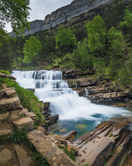 Fototapeta premium Gradas de Soaso backwater Ordesa y Monte Perdido National Park is in the north of the Iberian Peninsula, nestled in the center of the Pyrenean mountain range, in the Autonomous Community of Aragon. To