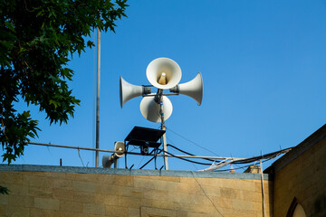 Megaphones on the roof of the mosque so that everyone can hear the sounds of the adhan