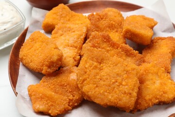 Tasty chicken nuggets on table, closeup view