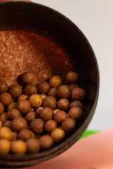 Make-up for the face, solid bronzer and bronzer for the face with shimmer and golden undertone in balls, loose powder, beauty products close-up.