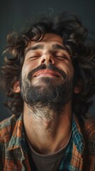 Obraz premium Close Up Portrait of a Man with Curly Hair and a Full Beard