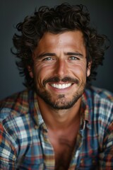 Fototapeta premium Portrait of a Smiling Man with Curly Hair