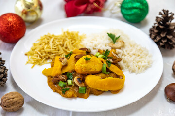 Traditional and exotic Brazilian dish rice, chicken and pequi (caryocar brasileinse) 
