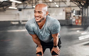 Man, athlete and smile with fitness in gym for exercise break, thinking and relax with workout challenge. Bodybuilder, person and thoughtful at sports center from bodybuilding, training and wellness