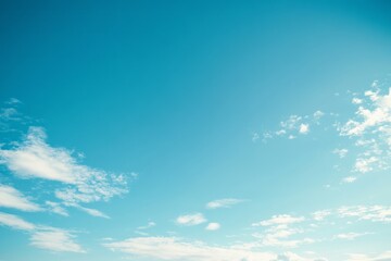 Fototapeta premium Bright Blue Sky with Scattered White Clouds