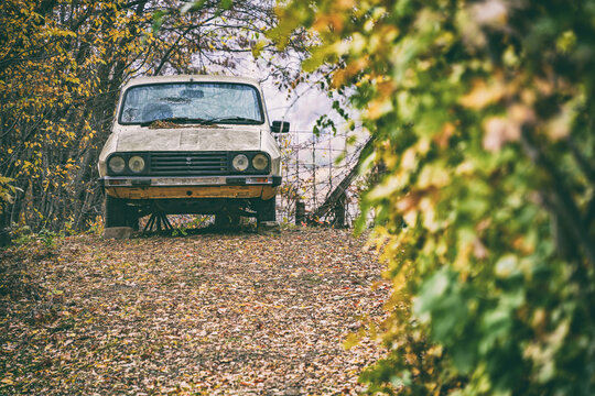 Image of an old Dacia 1310 car wreck in the outdoors.An old abandoned Dacia romanian car wreck at the side of the road