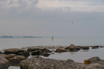 paddleboarder on calm waters 