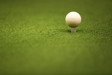 Golf ball on tee ready to be shot