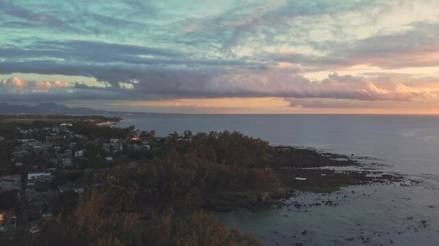 Aerial view in Mauritius over Pointe aux Piments beach at sunset, a beautiful tropical beach in the Indian Ocean