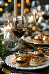 Fototapeta premium profiteroles with black caviar on the New Year's table 