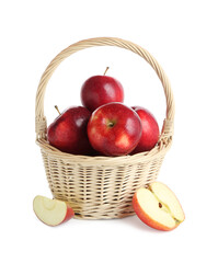 Fresh ripe red apples in wicker basket isolated on white