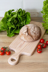 Fresh bread on a wooden board.