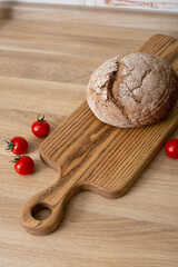 Fresh bread on a wooden board.