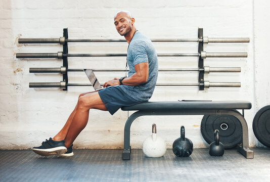 Laptop, portrait and manager with man in gym for fitness instructor, planning and digital membership record. Online schedule, personal trainer and equipment supervisor with person in health facility