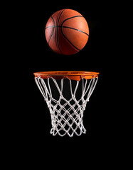 Basketball and Basketball Hoop floating or flying, isolated on a Dark black