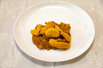 Traditional and exotic Brazilian dish rice, chicken and pequi (caryocar brasileinse) 