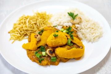 Traditional and exotic Brazilian dish rice, chicken and pequi (caryocar brasileinse) 