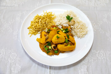 Traditional and exotic Brazilian dish rice, chicken and pequi (caryocar brasileinse) 