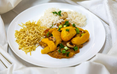 Traditional and exotic Brazilian dish rice, chicken and pequi (caryocar brasileinse) 