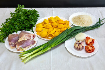 Traditional and exotic Brazilian dish rice, chicken and pequi (caryocar brasileinse) 