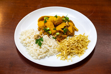 Traditional and exotic Brazilian dish rice, chicken and pequi (caryocar brasileinse) 