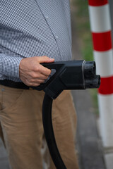 Electric Vehicle Charger in Hand