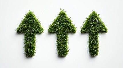 Three green arrows made of lush grass on a white isolated background.
