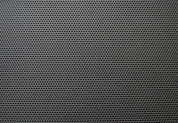 Perforated metal pattern industrial background