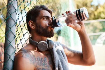 Fitness, court or man with water for drinking, hydration or break for basketball competition...