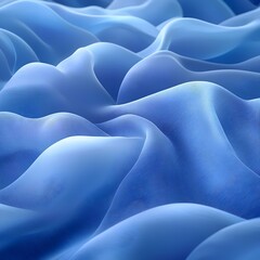 Obraz premium An abstract close-up of flowing fabric in varying shades of blue, creating a soothing and serene visual experience with soft curves and gentle waves.