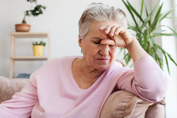 middle aged lady looking away sit alone at home feel anxious lonely, sad