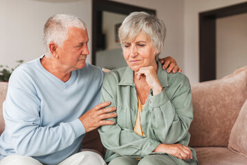 Sad husband feels sorry for his suffering senior wife, provides support and love