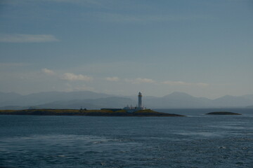 lighthouse on the scottish seafront, isle of mull iona