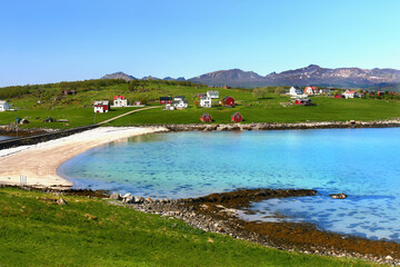 Arctic polar landscape. Fishing village, mountains and arctic fjord. Northern Norway