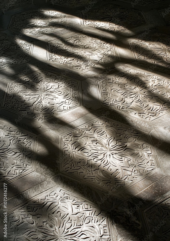 Poster A patterned floor with a shadow cast on it