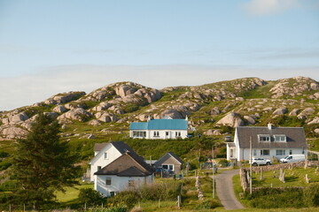 house in a small scottish village on the hill with a blue roof