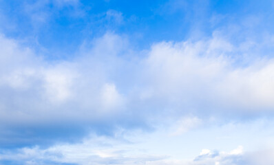 Beautiful blue sky and white fluffy group of clouds background in the morning skyline