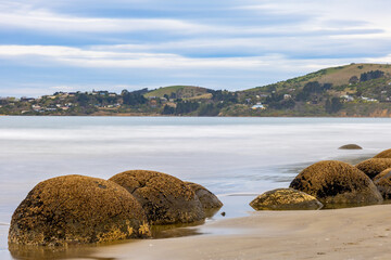 Long exposure shot of Moeraki Boulders in New Zealand. Famous landmark large spherical stones on Koekohe Beach near Moeraki on New Zealand's Otago coast. A popular tourist attraction