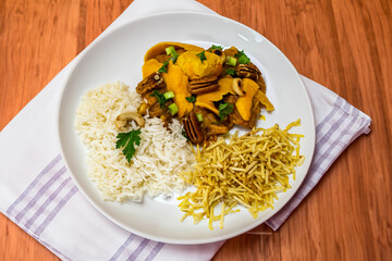 Gourmet and exotic Brazilian dish rice, chicken and pequi (caryocar brasileinse) 