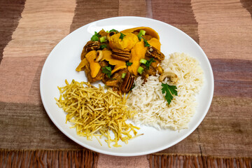 Gourmet and exotic Brazilian dish rice, chicken and pequi (caryocar brasileinse) 