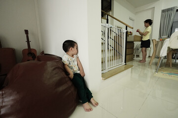 Little asian boy playing blindfold
