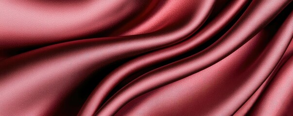 Obraz premium A close-up view of luxurious, shimmering red fabric, showcasing its smooth texture and elegant draping.