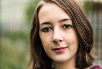 Outdoor portrait of a white 17 yo girl in Molenbeek, Brussels, Belgium